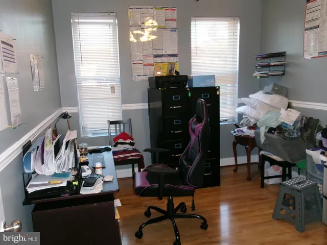 a bathroom with a granite countertop sink a toilet and a mirror