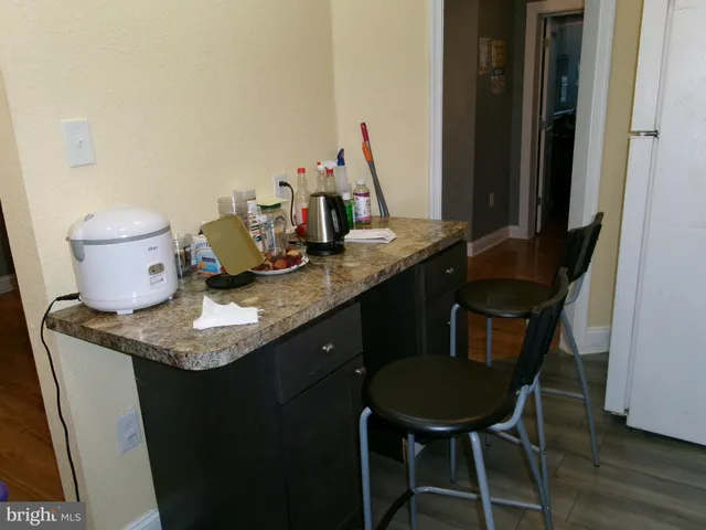 a room with furniture and musical instruments