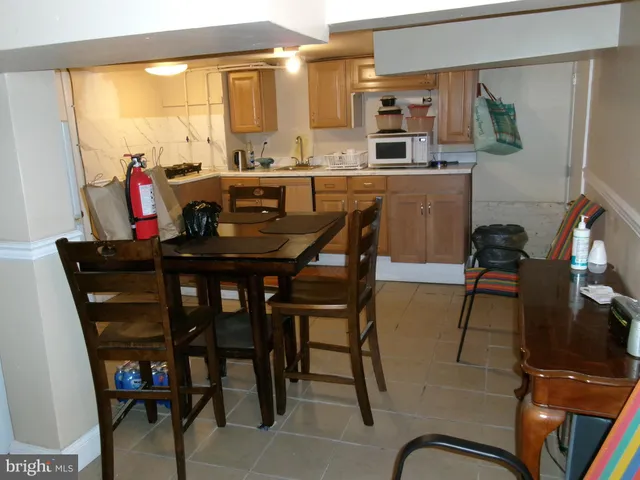 a room with storage and a potted plant on it