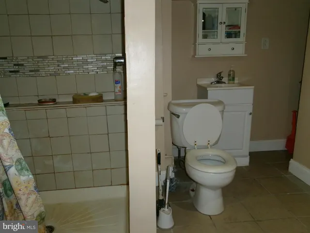 a bathroom with a toilet and a sink