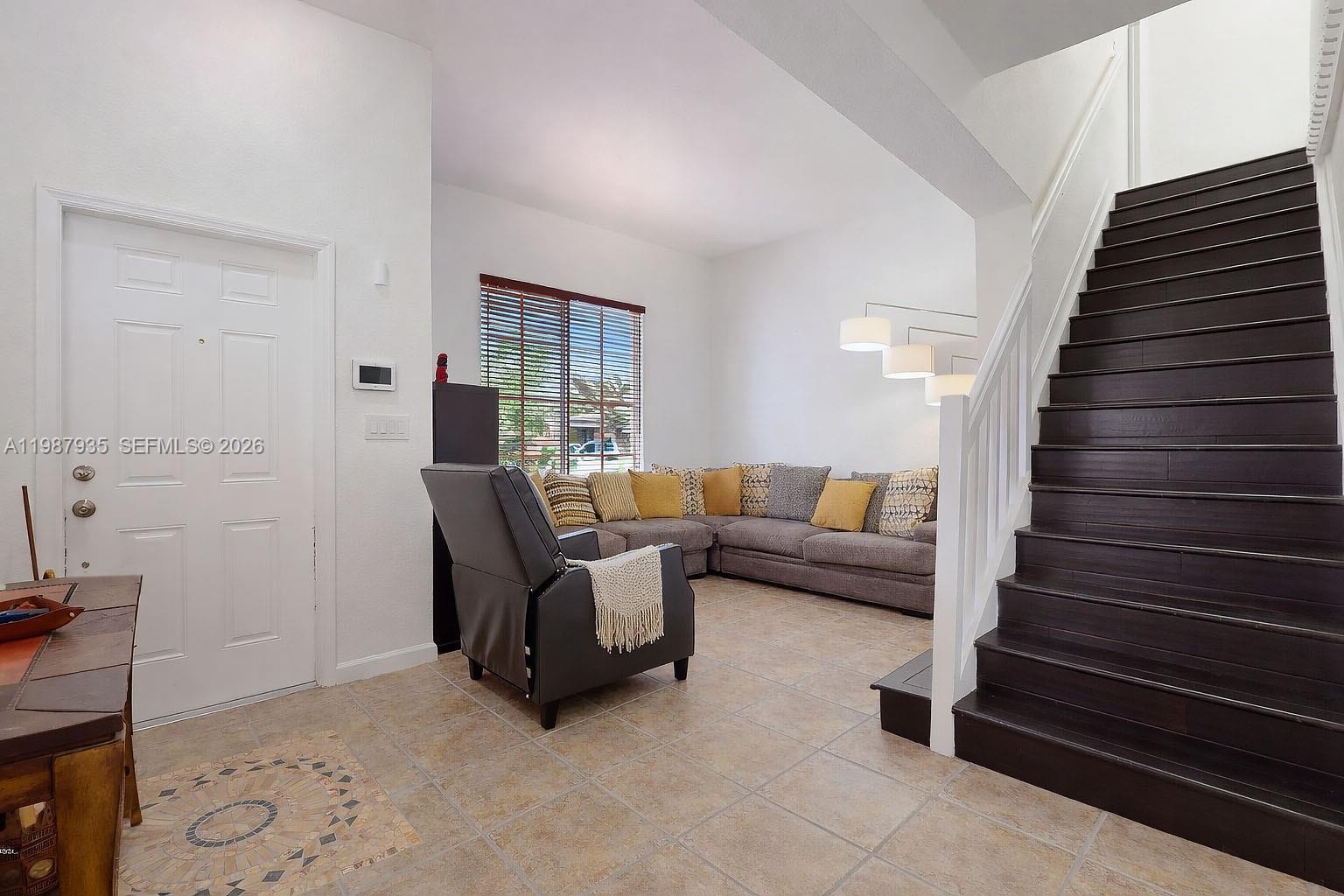 16479 Southwest 50th Terrace Miami, FL 33185 - Photo 11 of 51 a living room with furniture and wooden floor