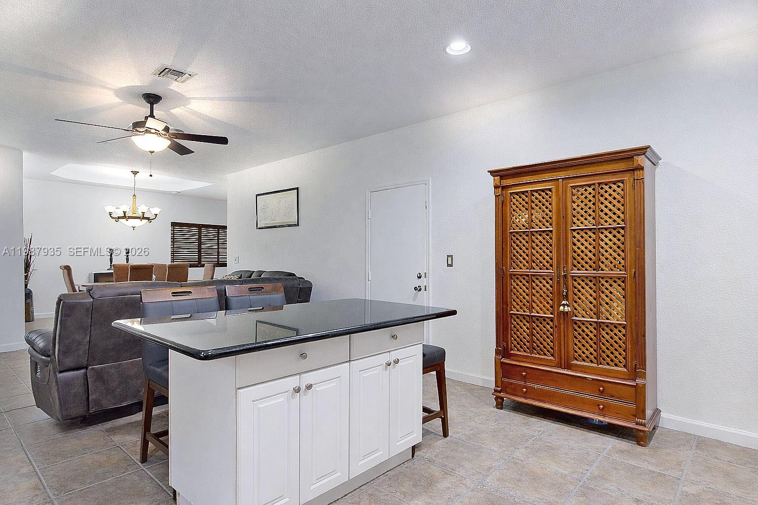 16479 Southwest 50th Terrace Miami, FL 33185 - Photo 22 of 51 a kitchen with a sink and cabinets