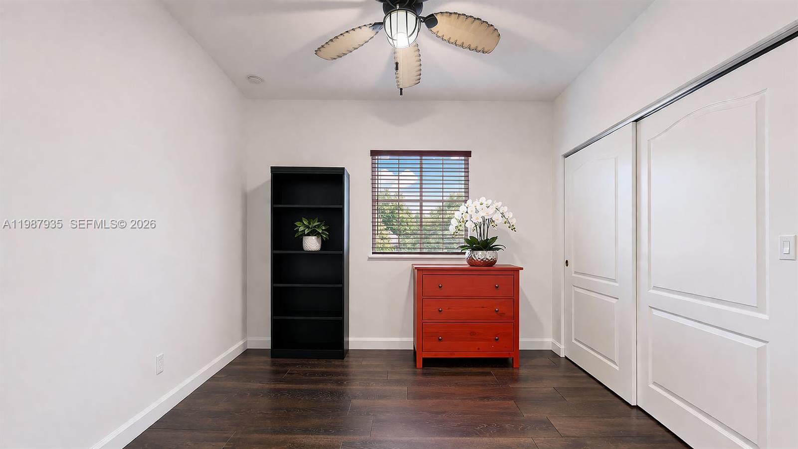 16479 Southwest 50th Terrace Miami, FL 33185 - Photo 29 of 51 a room with wooden floor and closet