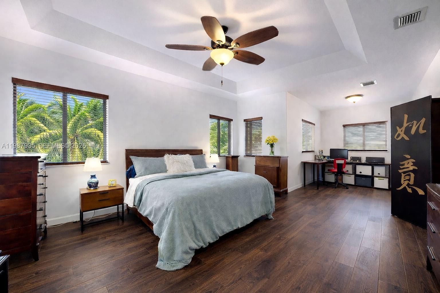 16479 Southwest 50th Terrace Miami, FL 33185 - Photo 34 of 51 a bedroom with a bed and a large window