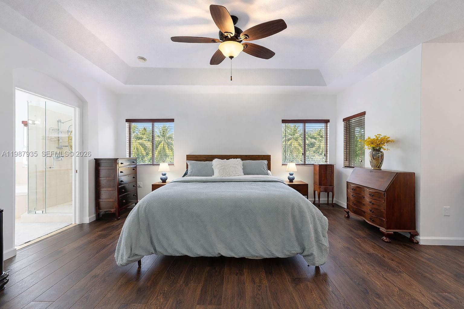 16479 Southwest 50th Terrace Miami, FL 33185 - Photo 36 of 51 a bedroom with a bed a window and lamps