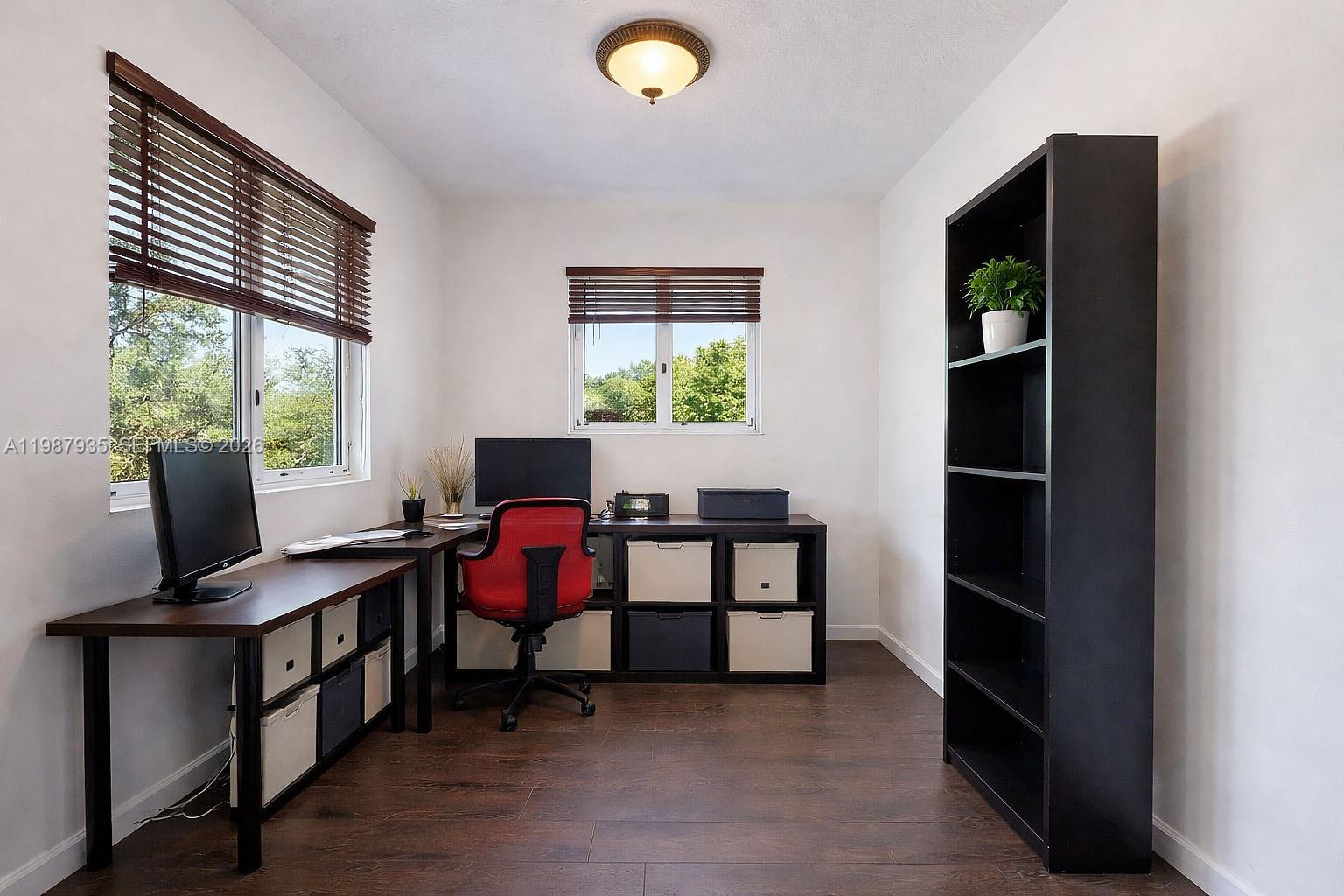 16479 Southwest 50th Terrace Miami, FL 33185 - Photo 37 of 51 a view of a workspace with furniture and a window