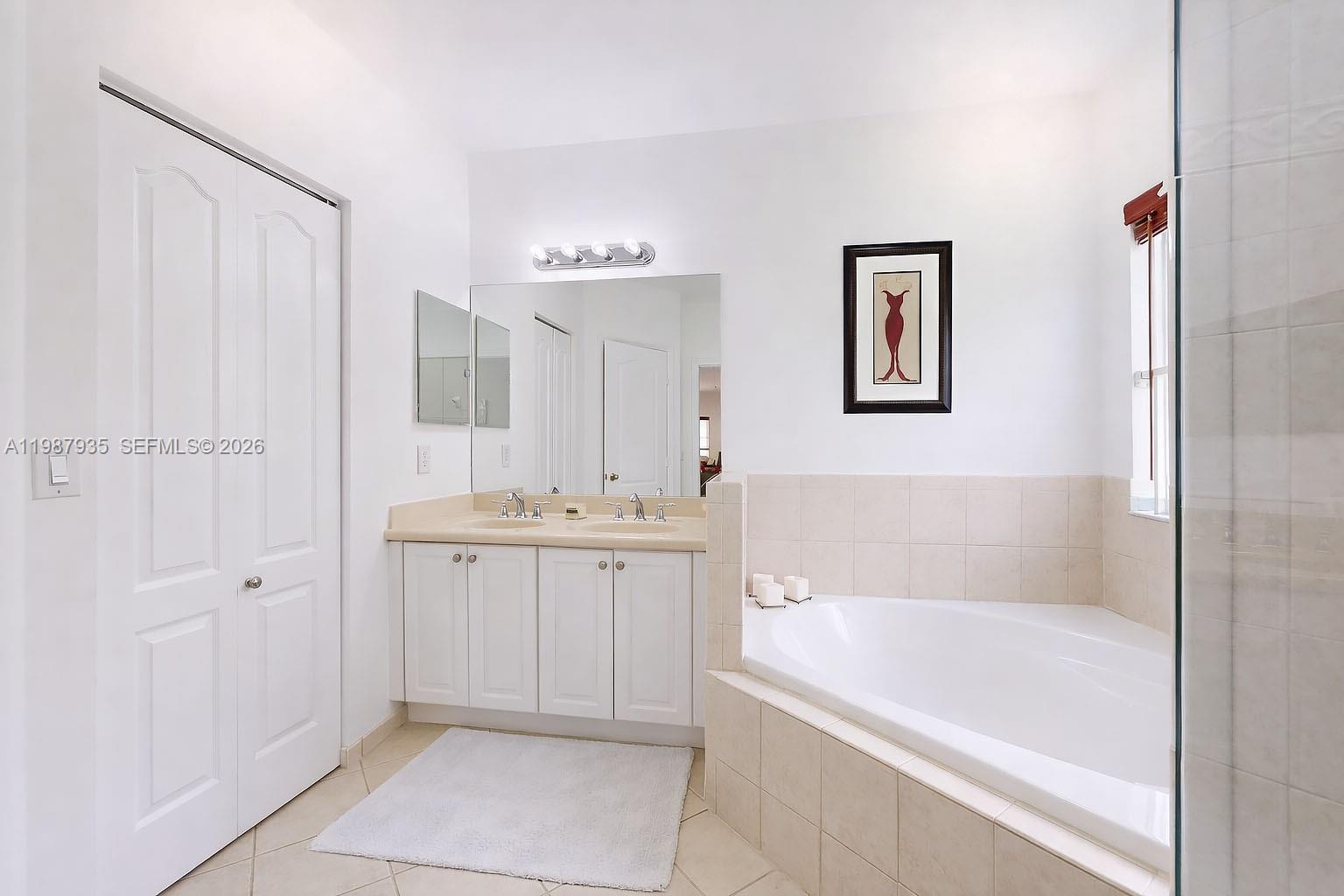 16479 Southwest 50th Terrace Miami, FL 33185 - Photo 38 of 51 a bathroom with a bathtub and a sink