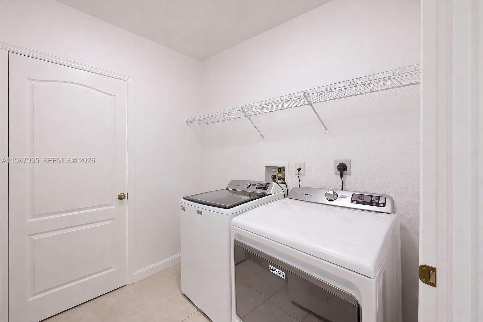 16479 Southwest 50th Terrace Miami, FL 33185 - Photo 41 of 51 a utility room with dryer and washer