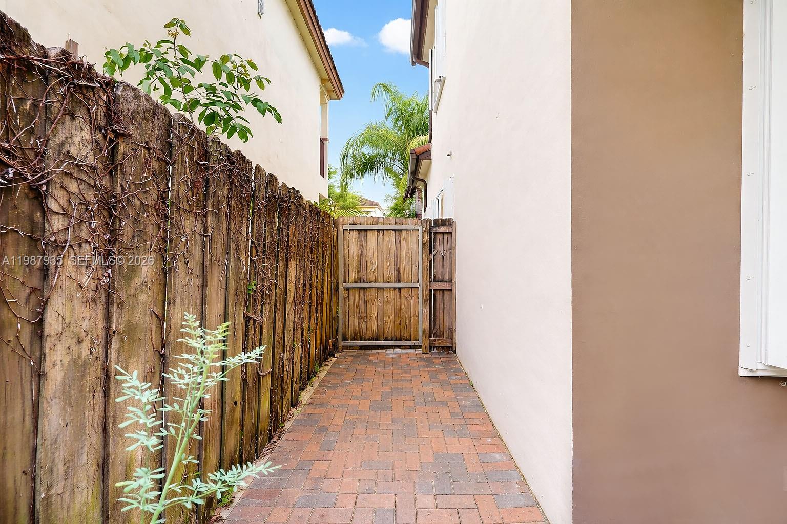 16479 Southwest 50th Terrace Miami, FL 33185 - Photo 44 of 51 a view of a pathway with a potted plants