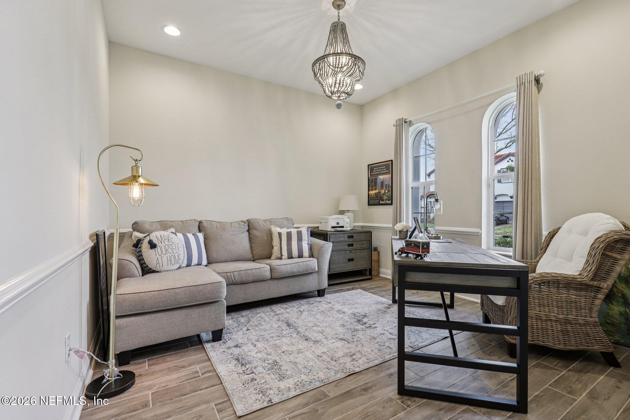 97 Rialto Drive Ponte Vedra, FL 32081 - Photo 8 of 48 a living room with furniture and a chandelier