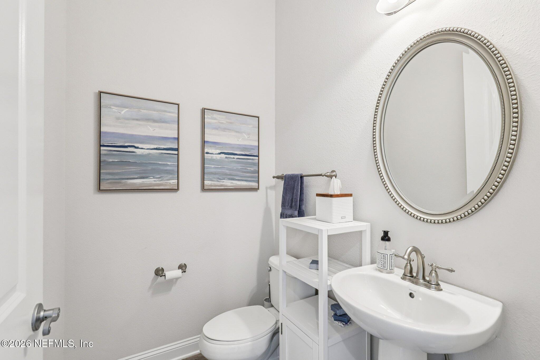 97 Rialto Drive Ponte Vedra, FL 32081 - Photo 10 of 48 a bathroom with a toilet a sink and a mirror