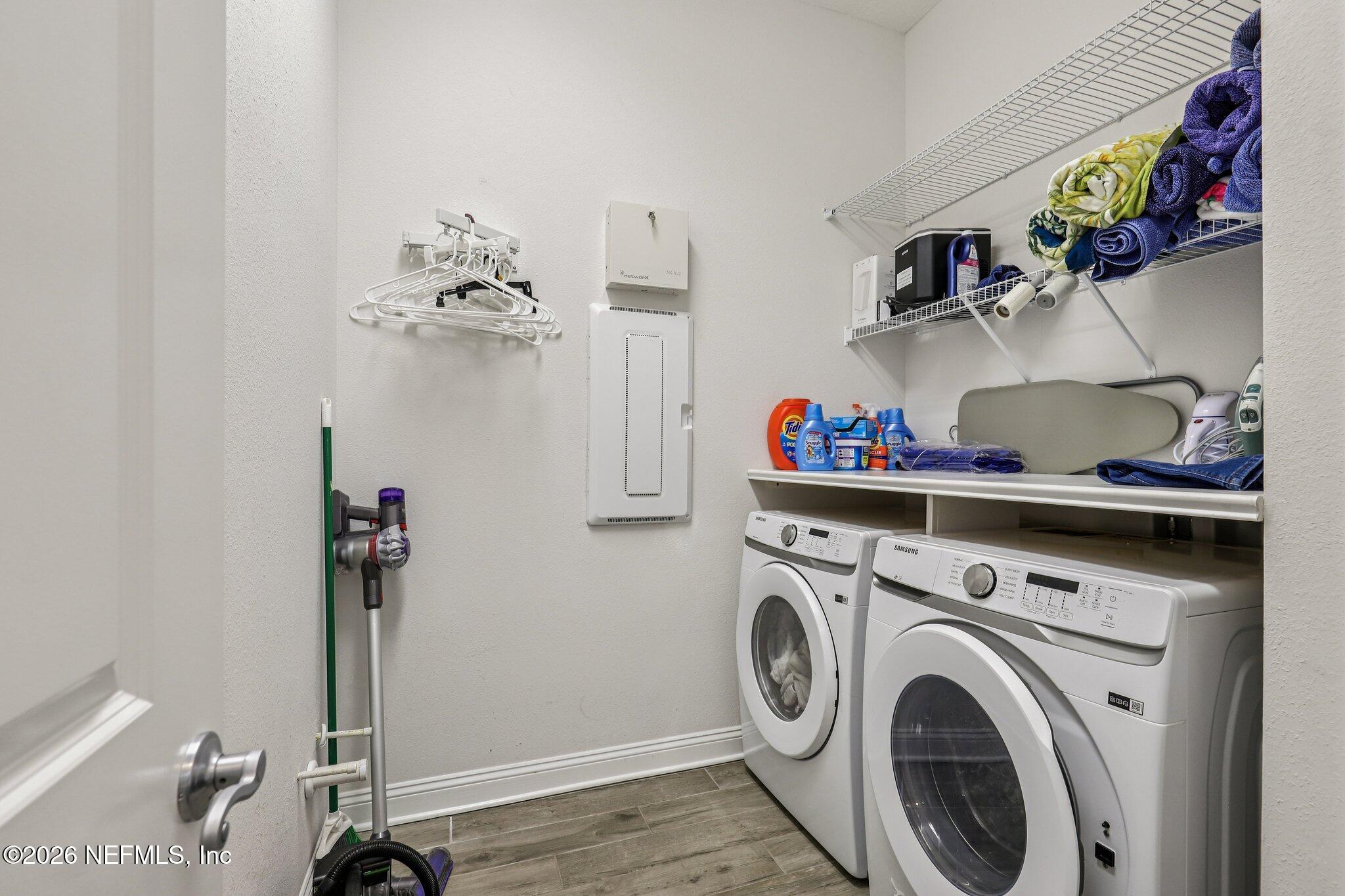 97 Rialto Drive Ponte Vedra, FL 32081 - Photo 11 of 48 a utility room with dryer washer and a view of living room