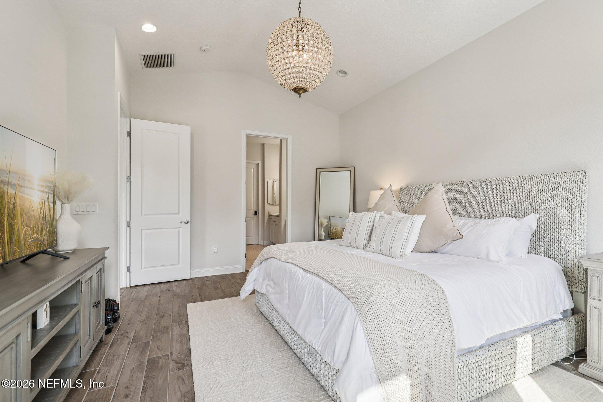 97 Rialto Drive Ponte Vedra, FL 32081 - Photo 13 of 48 a spacious bedroom with a bed and a flat screen tv