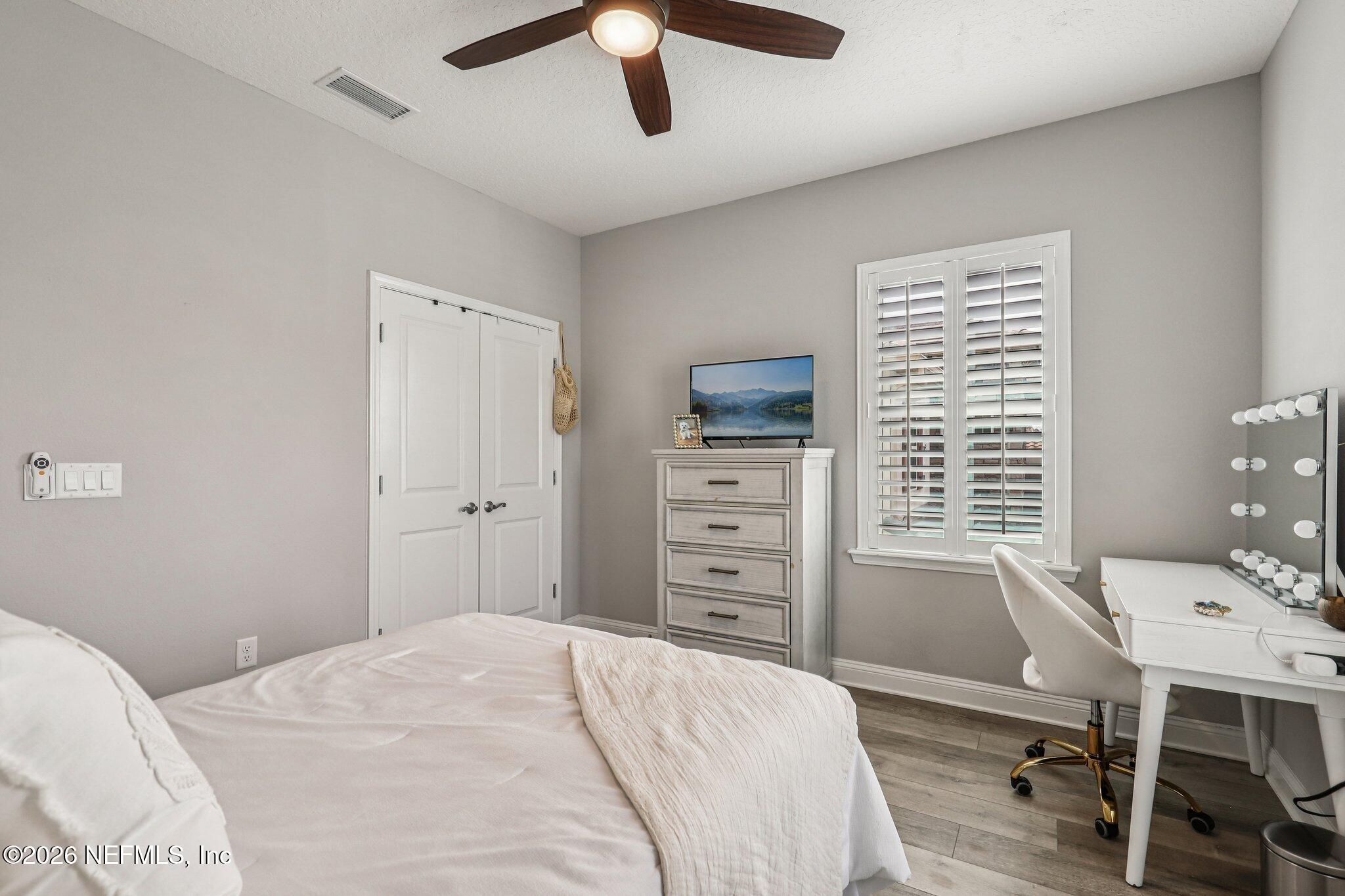 97 Rialto Drive Ponte Vedra, FL 32081 - Photo 20 of 48 a bedroom with a bed and a desk