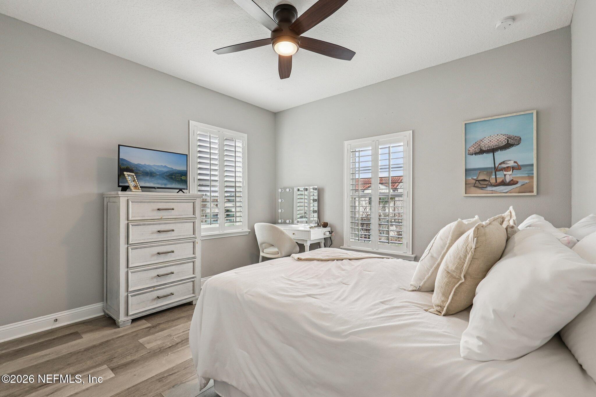 97 Rialto Drive Ponte Vedra, FL 32081 - Photo 21 of 48 a bedroom with a bed and a tv