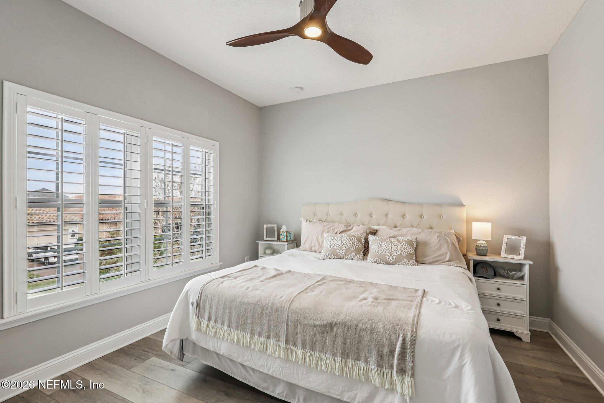 97 Rialto Drive Ponte Vedra, FL 32081 - Photo 22 of 48 a bedroom with a large bed and a large window