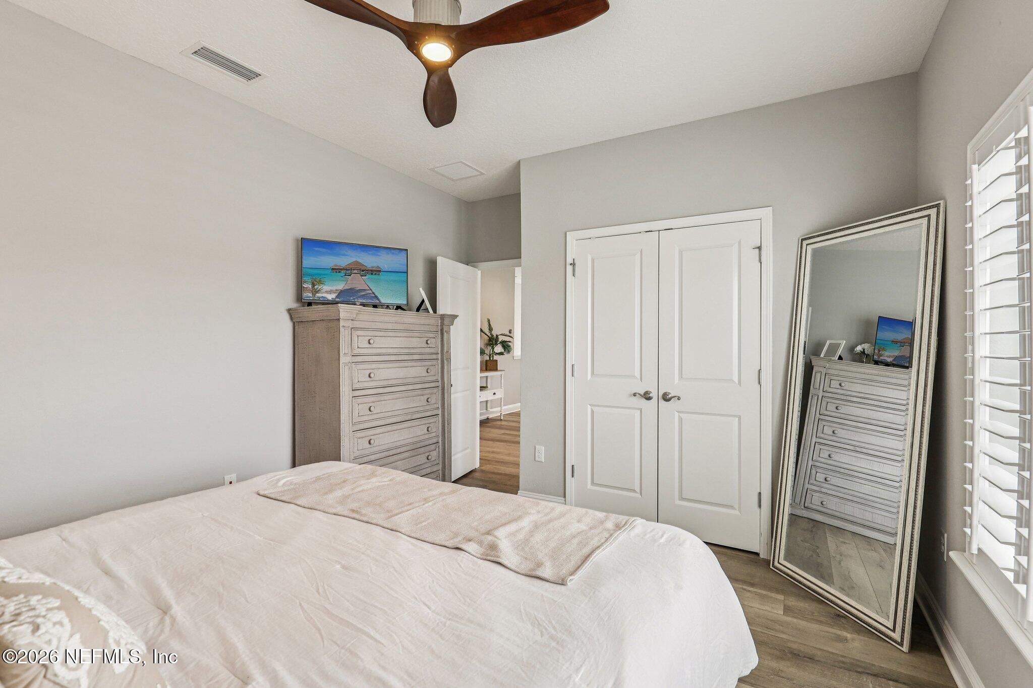 97 Rialto Drive Ponte Vedra, FL 32081 - Photo 23 of 48 a bedroom with a bed and a dresser