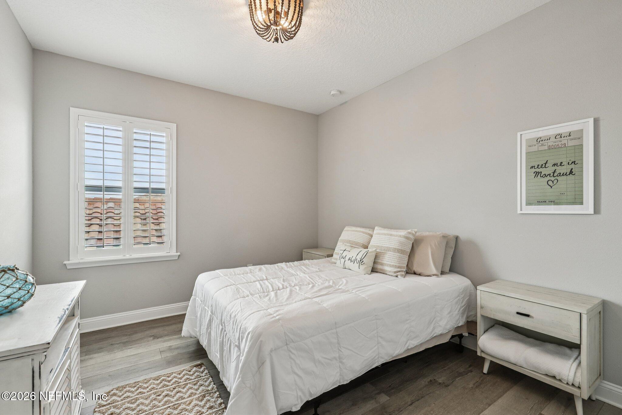 97 Rialto Drive Ponte Vedra, FL 32081 - Photo 24 of 48 a bedroom with a bed and a window