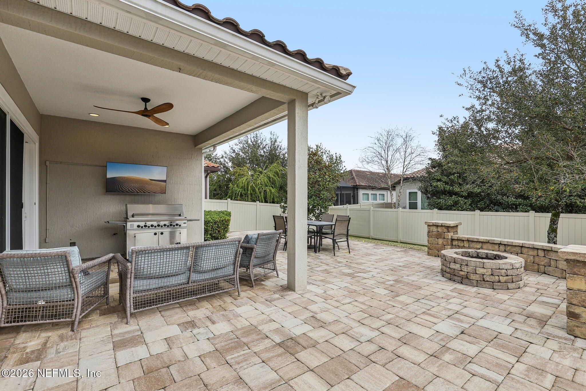 97 Rialto Drive Ponte Vedra, FL 32081 - Photo 29 of 48 a view of a patio with a dining table and chairs