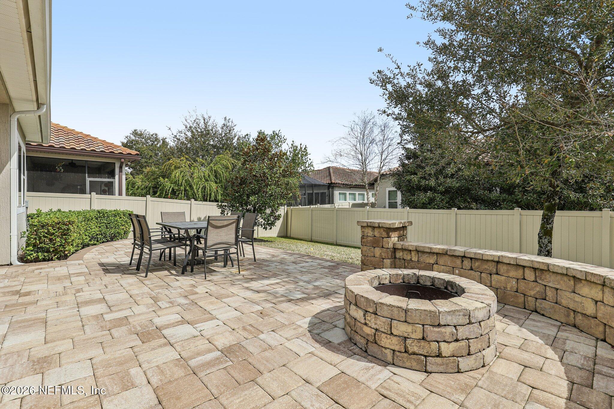 97 Rialto Drive Ponte Vedra, FL 32081 - Photo 30 of 48 a view of a backyard with table and chairs