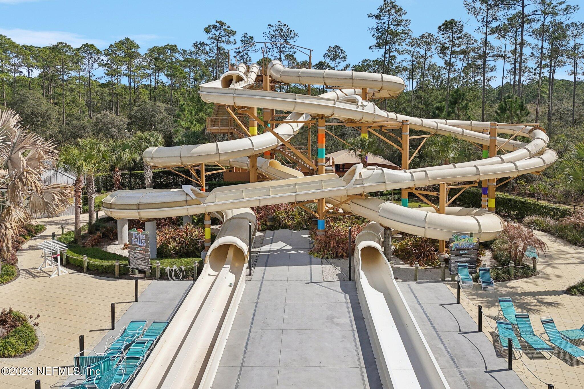 97 Rialto Drive Ponte Vedra, FL 32081 - Photo 42 of 48 an aerial view of a swimming pool with outdoor seating and plants