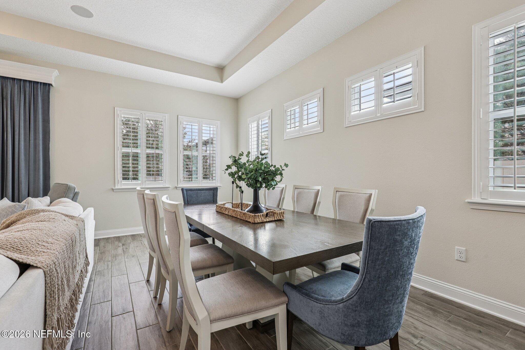 97 Rialto Drive Ponte Vedra, FL 32081 - Photo 3 of 48 a view of a dining room with furniture and wooden floor