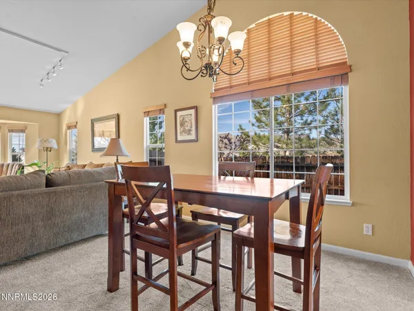 a view of a dining room with furniture window and outside view
