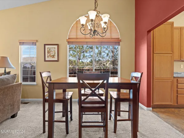 a view of a dining room with furniture window and outside view