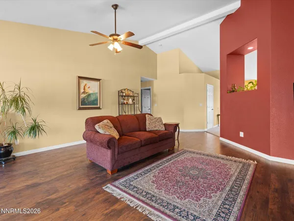 a living room with furniture and a rug