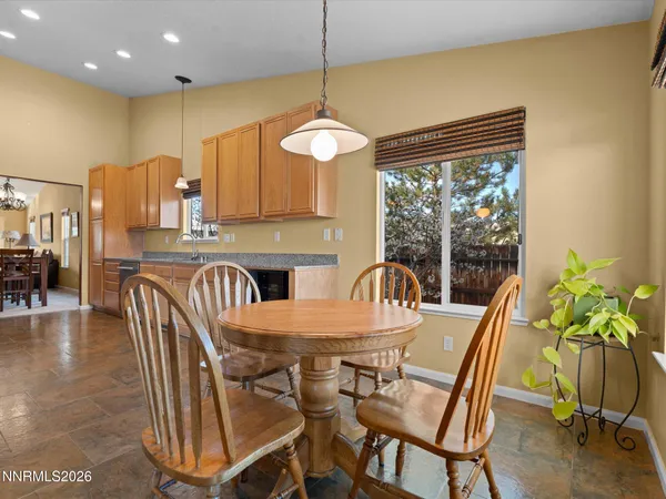 a view of a dining room with furniture window and outside view