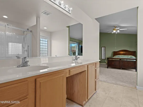 a bedroom with furniture and a flat screen tv