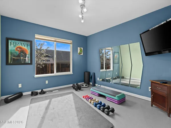 a living room with a couch and a large window