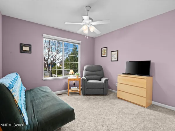 a view of a patio with iron fence