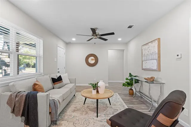 a living room with furniture and a window