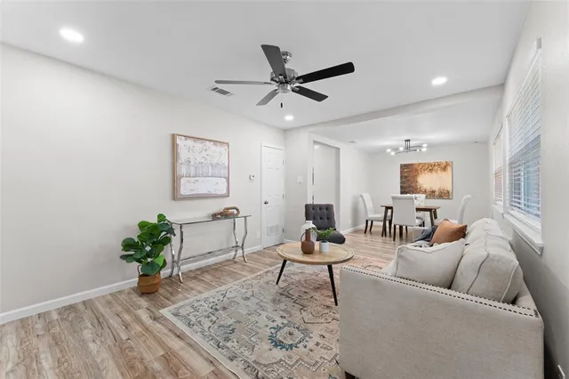a living room with furniture and a rug