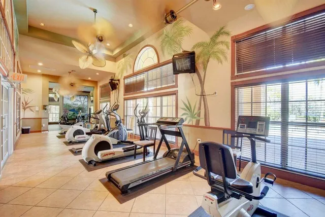 a view of a livingroom with furniture and a floor to ceiling window