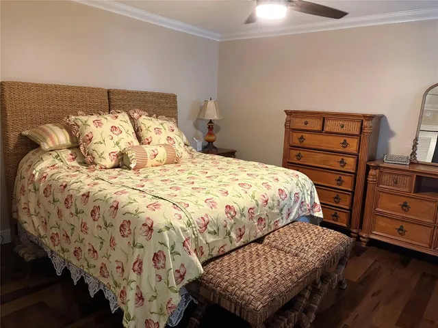 a bedroom with a bed and dresser