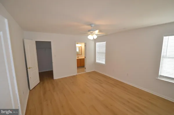 a bathroom with sink a mirror a vanity and window
