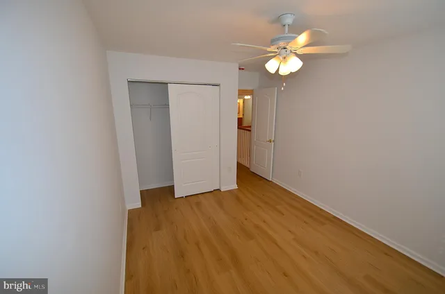 a bathroom with a sink mirror vanity and toilet