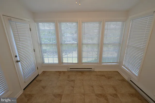 a bathroom with a sink mirror vanity and toilet