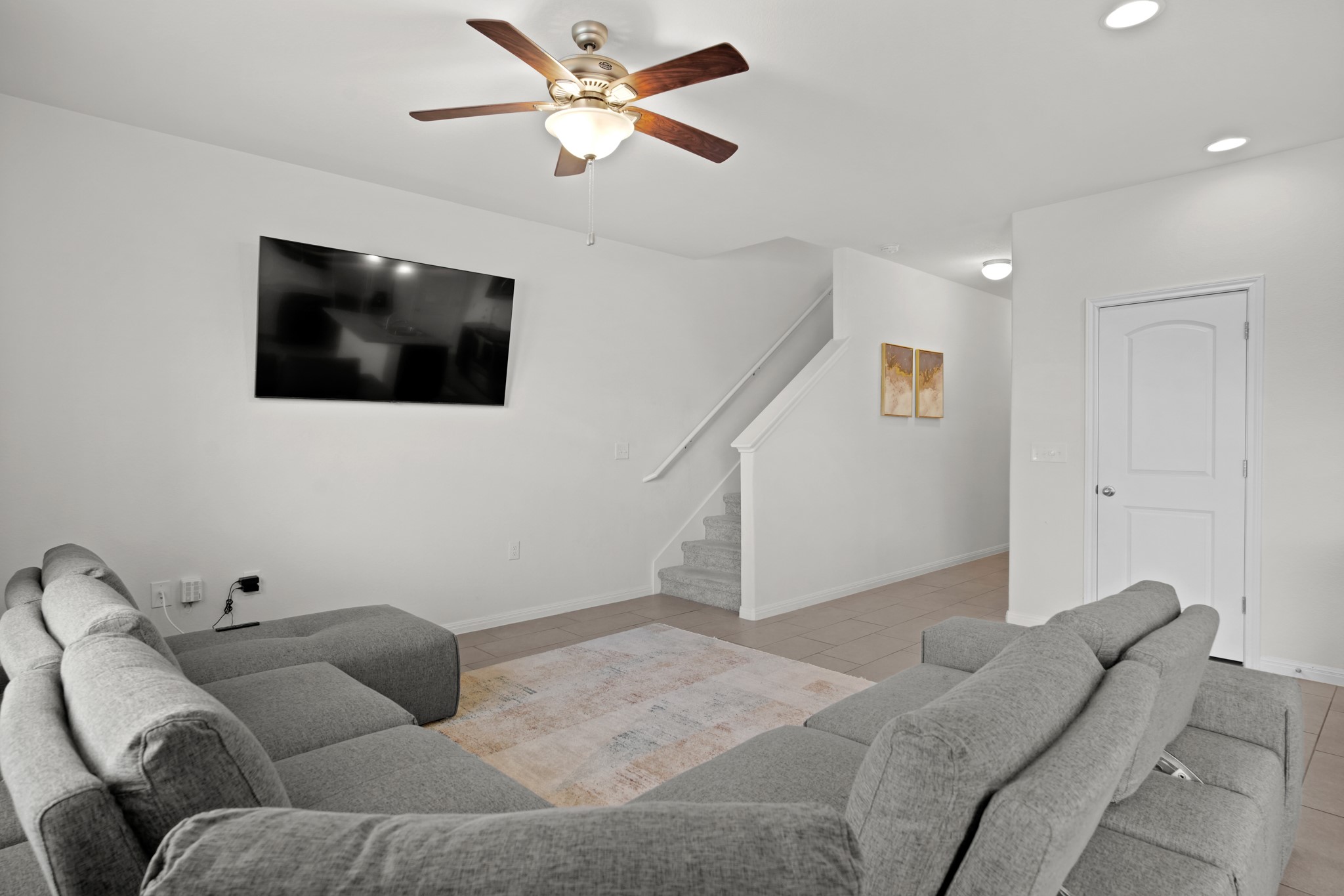 13005 Foreston Drive Austin, TX 78754 - Photo 7 of 36 a living room with furniture and a flat screen tv