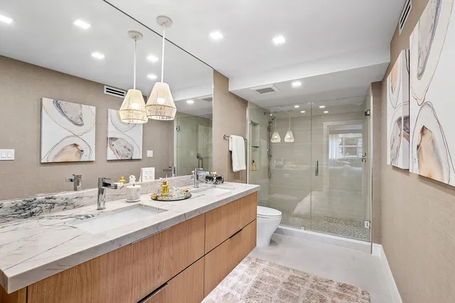 a bathroom with a sink double vanity and a mirror