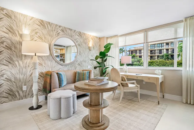 a living room with furniture a window and a table