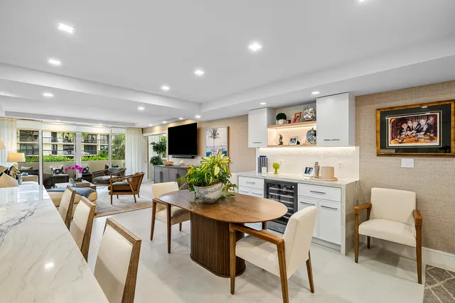 a view of a dining room with furniture and a livingroom