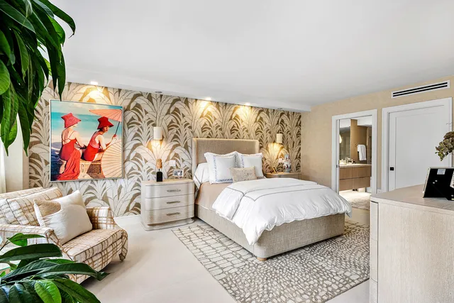 a bedroom with a bed couch and a window