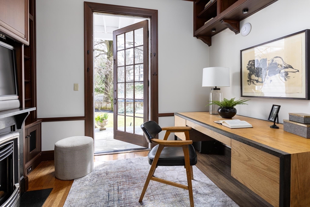 57 Hedge Road Brookline, MA 02445 - Photo 12 of 37 a room with a couch and a potted plant