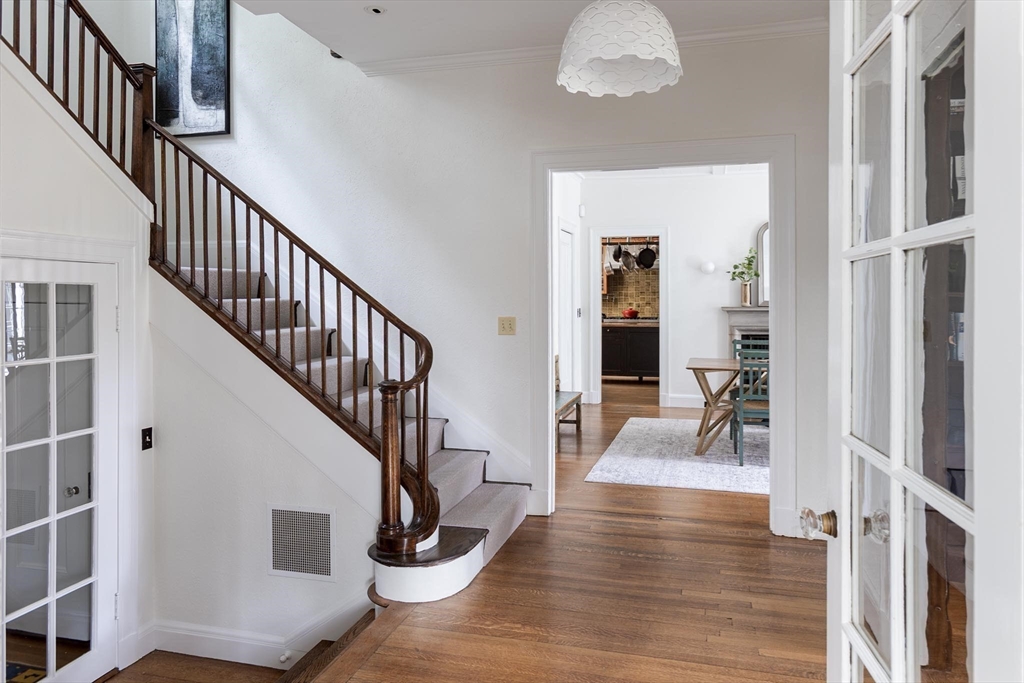 57 Hedge Road Brookline, MA 02445 - Photo 17 of 37 a view of entryway and hall with wooden floor