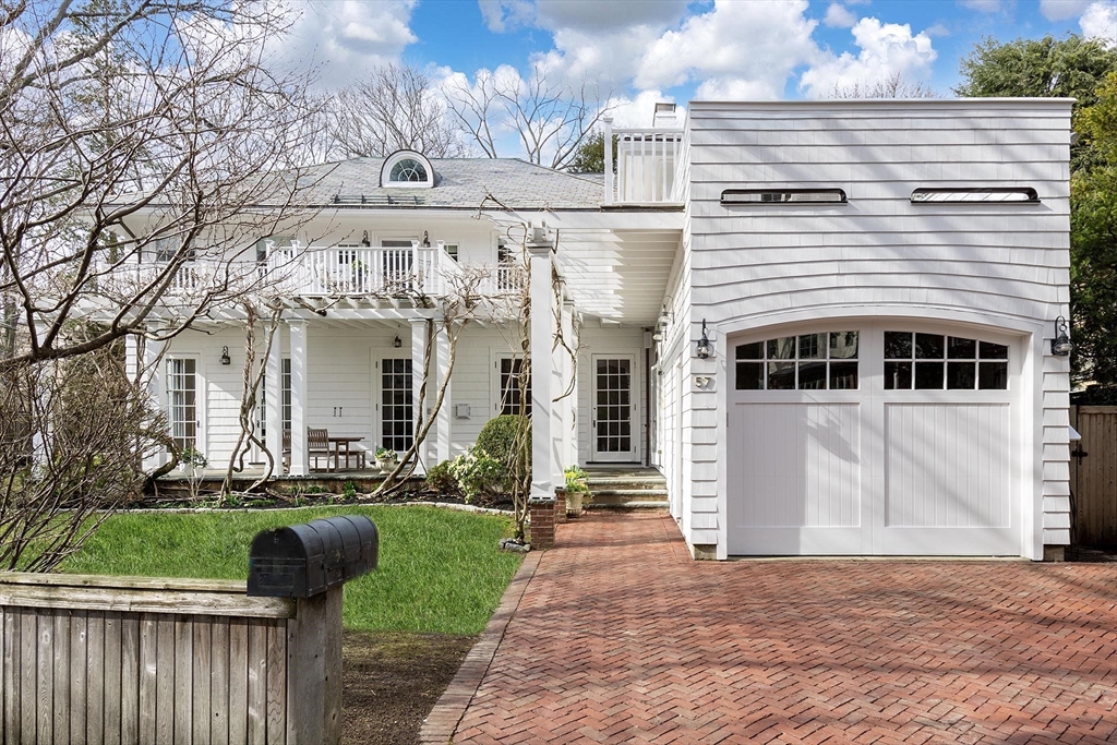 57 Hedge Road Brookline, MA 02445 - Photo 2 of 37 a front view of a house with a yard