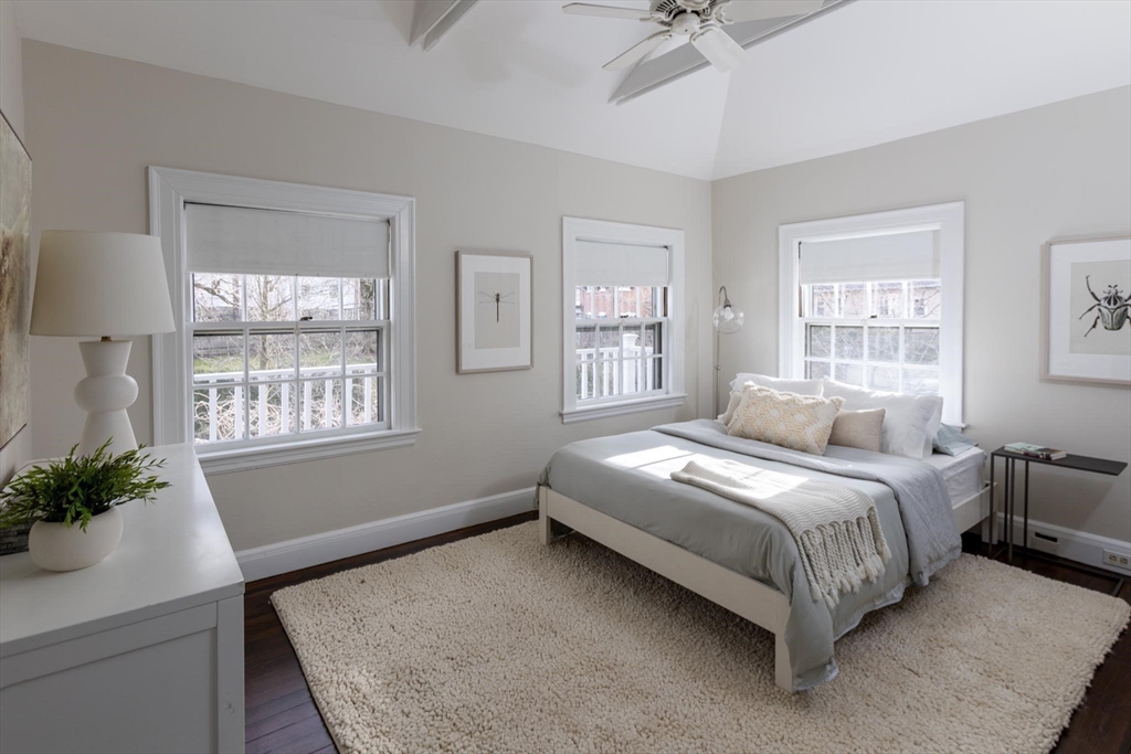 57 Hedge Road Brookline, MA 02445 - Photo 21 of 37 a bedroom with a bed table and windows