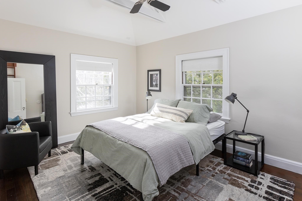 57 Hedge Road Brookline, MA 02445 - Photo 22 of 37 a bedroom with a bed and wooden floor